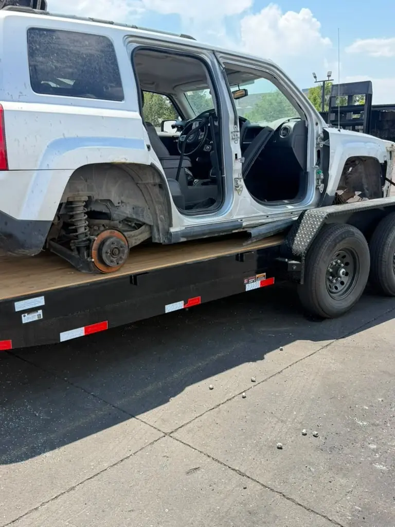 Disabled SUV loaded for vehicle hauling service