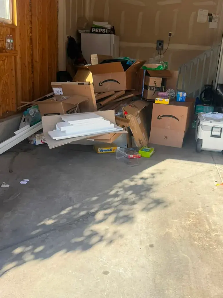 Garage cleanout with boxes and household items